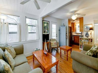 Beach cottage with polished living room wood floors